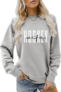 Close-up of gray long sleeve sweatshirt featuring white Hockey wife lettering and ribbed cuffs