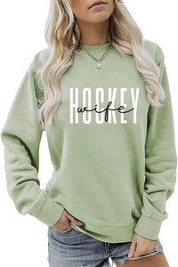 Detail of light green sweatshirt with white HOCKEY and black wife printed text