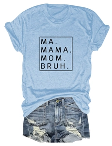 Flat lay of light blue T-shirt with MA MAMA MOM BRUH print and distressed denim shorts