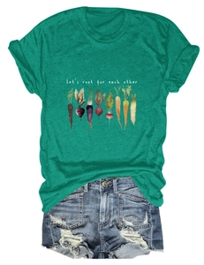 Flat lay of dark green T-shirt with vegetable prints and frayed denim shorts