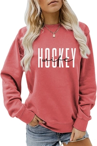 Close-up of white Hockey Wife print on a casual loose-fit ribbed crewneck sweatshirt