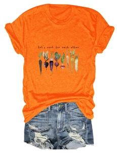 Detail of orange cotton T-shirt with Let's root for each other text and vegetable graphic