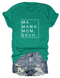 Close-up of green cotton t-shirt with Mama Mom Bruh print and frayed denim shorts