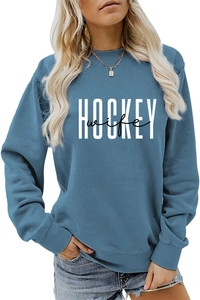 Close-up of blue crewneck sweatshirt with white HOCKEY and black wife printed lettering
