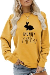 Close-up of mustard yellow sweatshirt featuring black bunny silhouette and Bunny Mom text