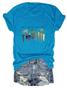 Flat lay of blue T-shirt with 'Let's root for each other' slogan and denim shorts