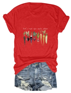 Detail of the Let's Root For Each Other slogan and vegetable print on a red cotton t-shirt