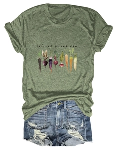 Detail of olive green t-shirt with vegetable prints and distressed denim shorts