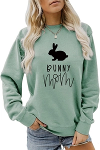 Close-up of sage green sweatshirt featuring a bunny silhouette and Bunny Mom print
