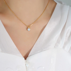 Minimalist 18K gold titanium necklace featuring a sparkling round zircon solitaire pendant