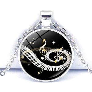 Silver music theme necklace with spiral piano keys and golden treble clef heart pendant