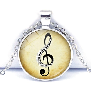 Vintage necklace with treble clef piano key pendant and parchment texture design