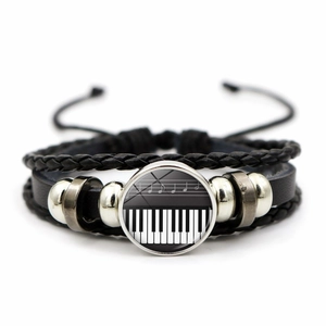 Handmade multilayer black leather bracelet featuring piano keys and music notes patterns
