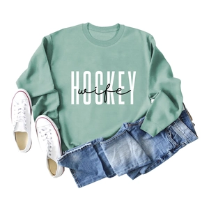Detail of mint green sweatshirt with white HOCKEY and black wife lettering print