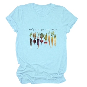 Close-up of light blue T-shirt with vegetable illustration and Let's root for each other text