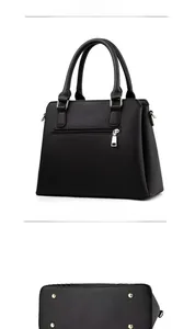 Détails du sac cabas en cuir noir avec pieds dorés et poche arrière zippée pratique