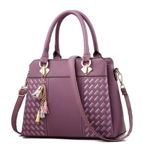 Sac à main violet élégant pour femmes avec texture tissée, doubles poignées et franges