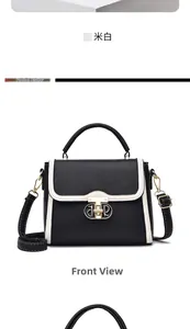 Détail du sac à bandoulière contrasté en cuir noir avec fermoir doré poli