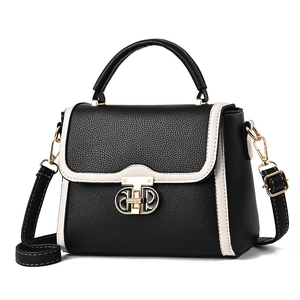 Sac à main classique bicolore noir et blanc avec fermoir doré et bandoulière réglable