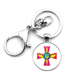 Detail of silver Ukraine Tryzub military emblem pendant with lobster clasp and cross