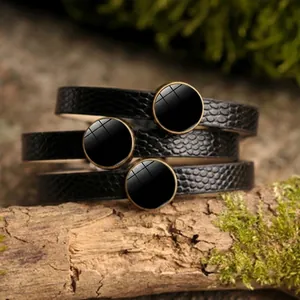 Three-piece set of black PU leather bracelets with snake texture and round bronze charms