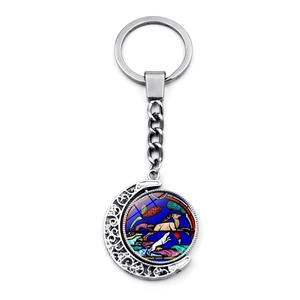 Silver crescent moon keychain with Notre Dame stained glass art and deer motif