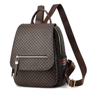 Women's brown geometric travel backpack with classic red and green striped webbing