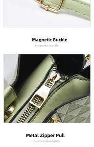 Detail view of light green quilted bucket bag with gold-tone metal buckle and sturdy zipper