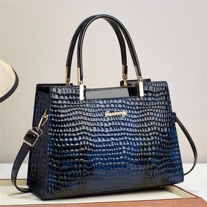 Glossy dark blue crocodile embossed shoulder bag with top handles and adjustable strap
