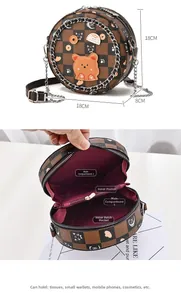 Detail view of round crossbody bag showing checkerboard pattern and internal pockets