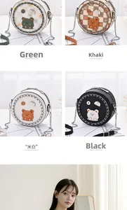 Detail of colorful mini round crossbody bags with cute cartoon bear and metal chains