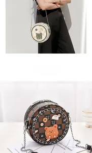 Close-up of a mini round crossbody bag featuring checkered PU leather and cute animal patches