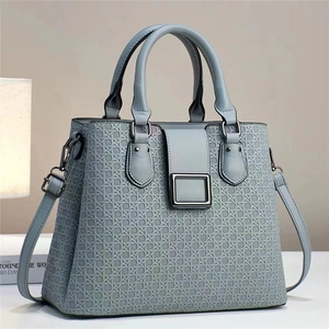 Sac à main bleu-gris élégant en cuir embossé avec texture tressée et bandoulière