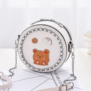 Minimalist white round PU leather crossbody bag with cartoon bear and silver chain trim