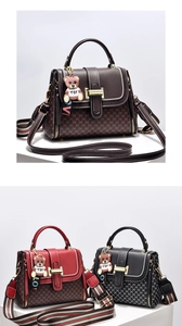 Detail of multi-color PU leather handbags with monogram patterns and bear charm