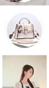 Detail of pink small square bag with teddy bear charm and striped crossbody strap