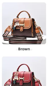 Detailed view of monogram square bags in mustard and red with bear charm and striped strap