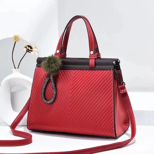 Red quilted large tote bag with top handle, contrast brown flap and detachable strap