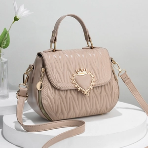 Elegant beige pleated handbag with crown heart clasp and adjustable shoulder strap for women