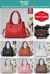 Detailed view of the large capacity crossbody handbag with its multi-layer zipper pockets