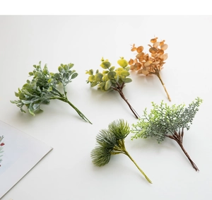Flat lay of artificial pine needles and eucalyptus leaves for Christmas DIY decoration