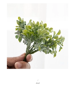 Close-up of realistic artificial pine needles and greenery for DIY Christmas wreaths