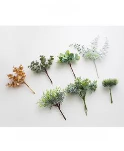 Detailed collection of assorted artificial green plant stems and frosted eucalyptus branches