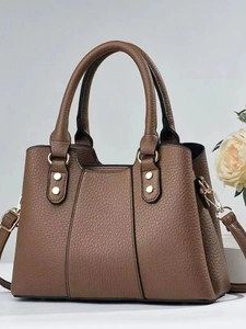 Brown litchi grain leather handbag for women with gold hardware and shoulder strap