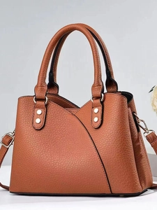 Brown textured leather handbag for women with dual handles and adjustable shoulder strap