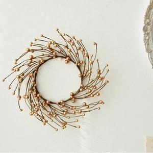 Golden berry Christmas wreath for festive wall decoration and holiday scene setup