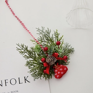 Christmas tree resin decoration with pine needles, berries, cones and red bow ornament