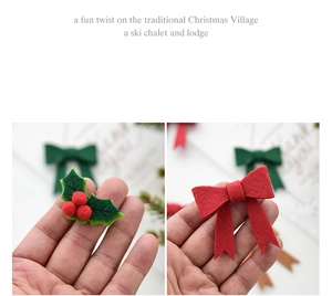 Detail of Christmas felt holly leaf and red bow DIY ornaments held by hand
