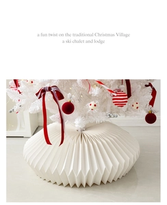 Close-up of white origami style Christmas tree base cover with modern pleated texture