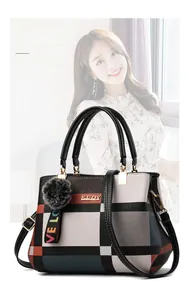 Chic multi-color checkered handbag featuring dual handles and a detachable shoulder strap